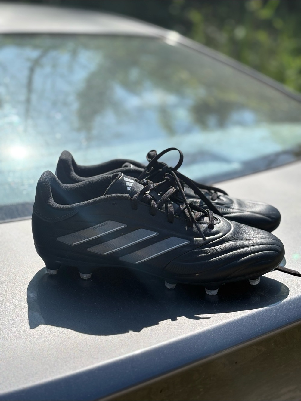adidas Men’s Black Soccer Cleats with Silver Stripes